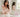 Femme vêtue d’une blouse rose pâle présentant un flacon de parfum dans une salle de bain claire et élégante.